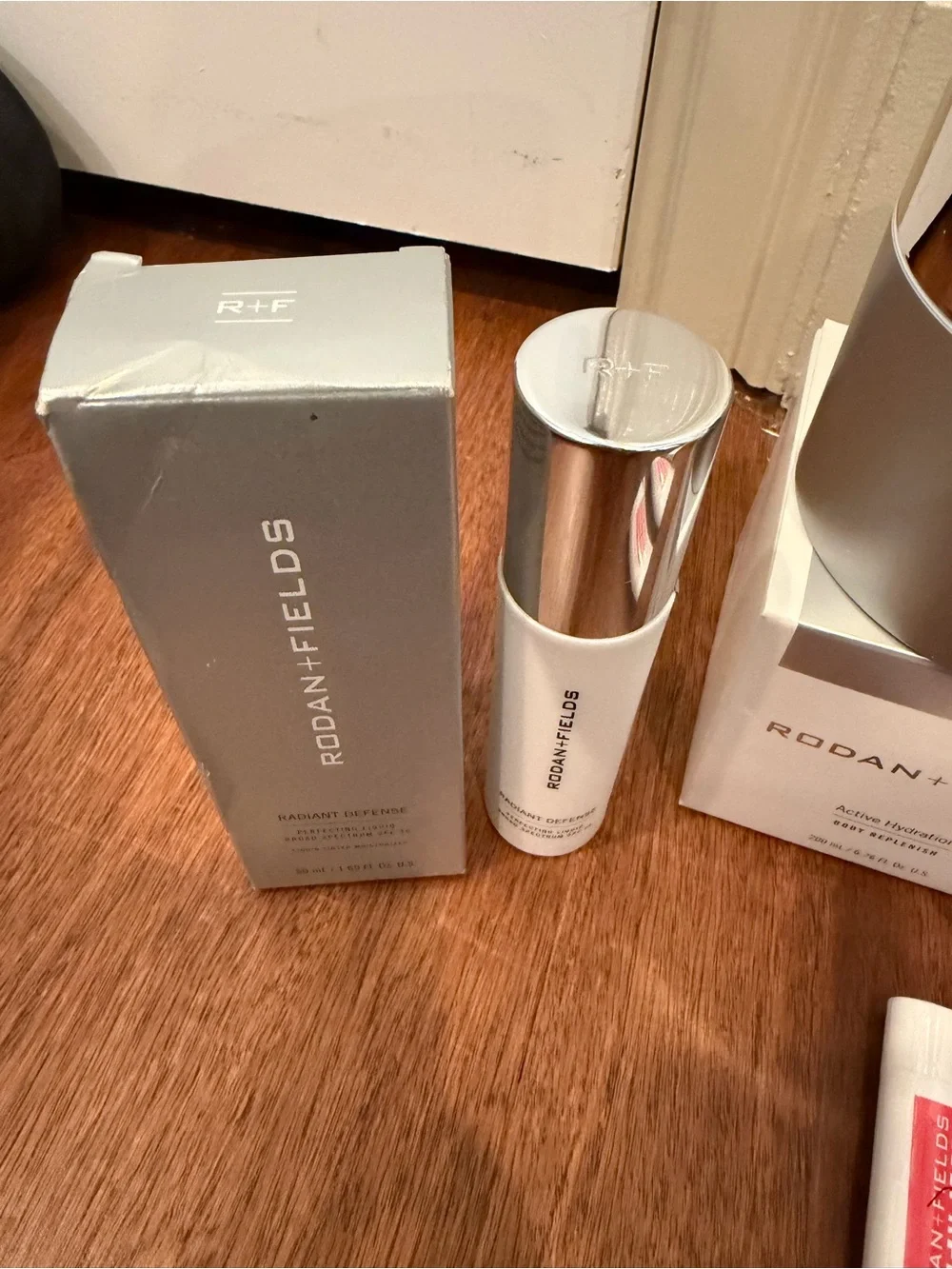 Rodan + Fields Lip & Skincare Set with Silver Packaging and Neutral Lip Shades
